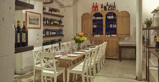 Intimate dining space with rustic decor in 54 Mint Cucina Romana for private events.