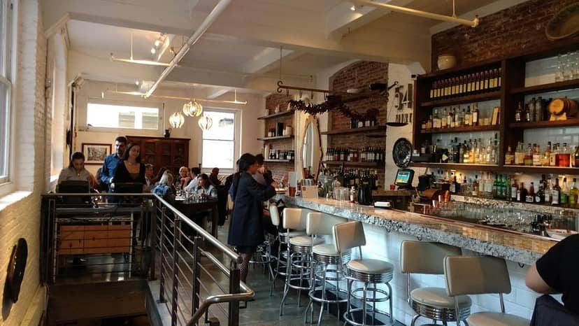 Modern basement venue with elegant bar for intimate gatherings and networking events.