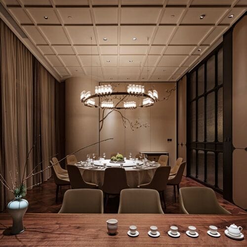 Elegant Mio Suites meeting space with round table, ideal for corporate events and private dinners.