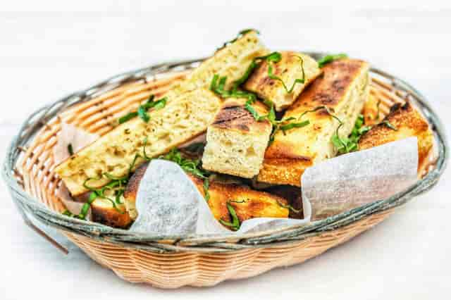 Appetizing focaccia bread basket at Amici's East Coast Pizzeria for events and catering.