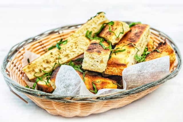 Appetizing focaccia bread basket at Amici's East Coast Pizzeria for events and catering.