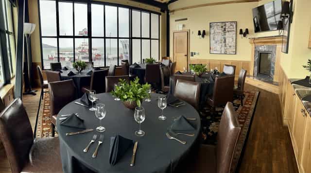 Elegant round tables in Bistro Boudin's Bakery Museum, perfect for corporate events.