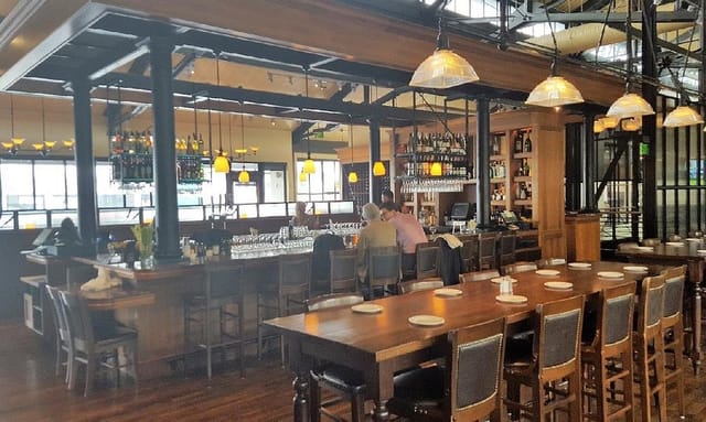 Modern Bistro Boudin with warm lighting, ideal for gatherings and dining events.