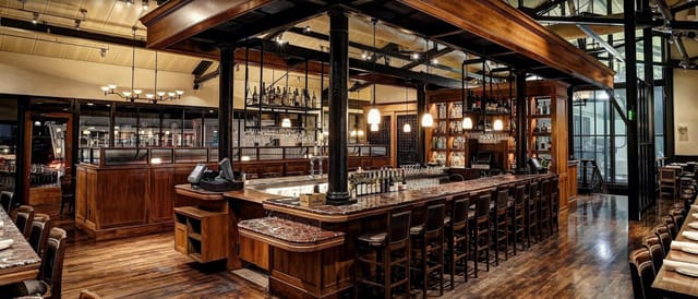 Stylish bar at Bistro Boudin, ideal for cocktail receptions and gatherings.