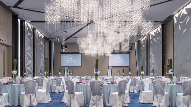 Elegant event space at InterContinental Beijing with pastel decor for corporate gatherings.