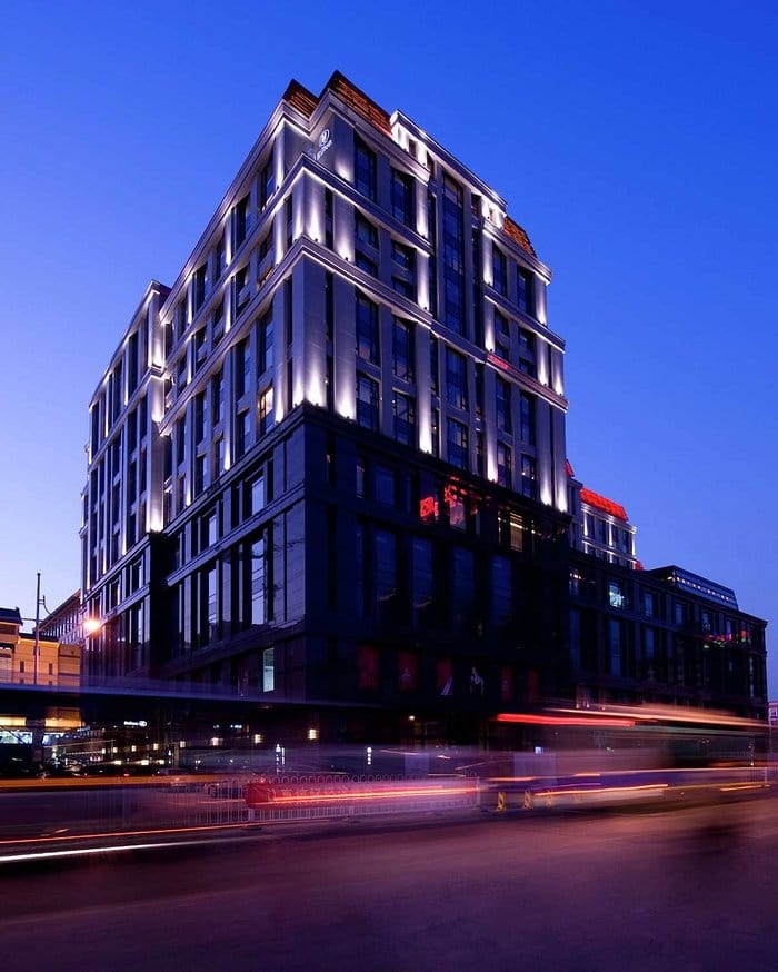 Modern illuminated hotel in Beijing, perfect for events and meetings at dusk.