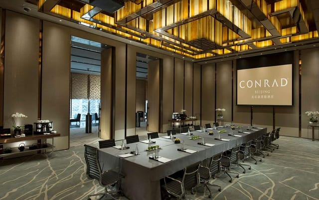 Sophisticated meeting room in Conrad Beijing for corporate events with natural light.