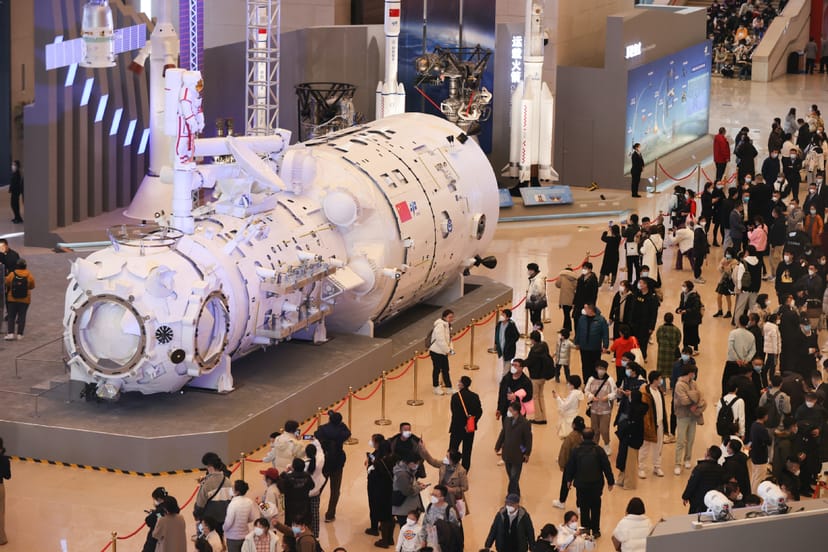 "Spacecraft model in National Museum of China exhibition hall for space exploration event."