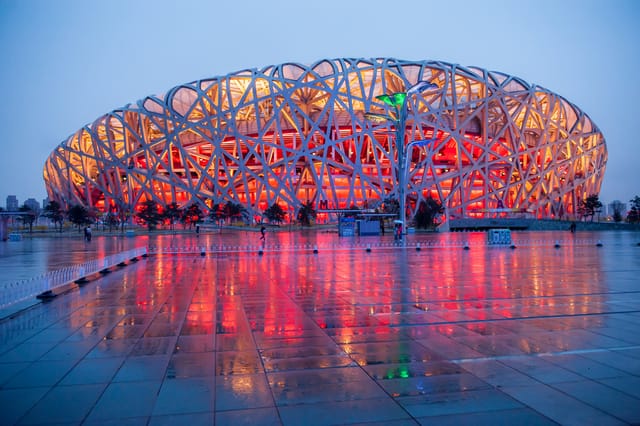 Stadium National Stadium with vibrant lighting for concerts and corporate events.