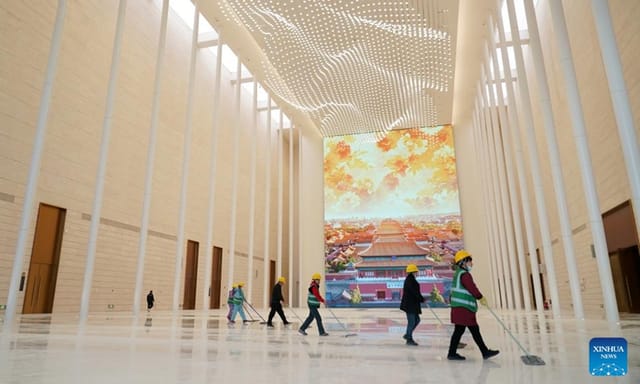 Spacious China World Exhibition Hall lobby with digital display for meetings and events.