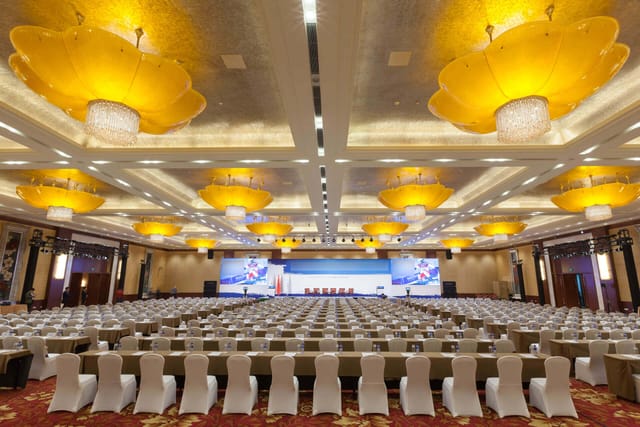 Golden Grand Hall at Beijing Hotel: spacious conference setup with elegant chairs, ideal for events.