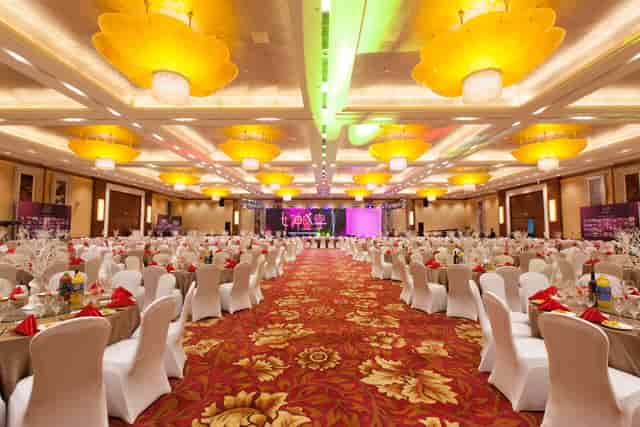 Golden Grand Hall banquet setup with elegant tables for corporate events in Beijing.