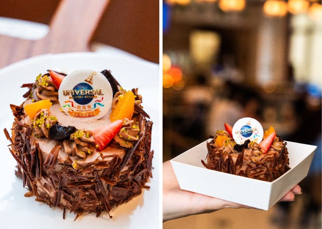 Chocolate cake centerpiece with vibrant fruit for Universal Beijing Resort parties.