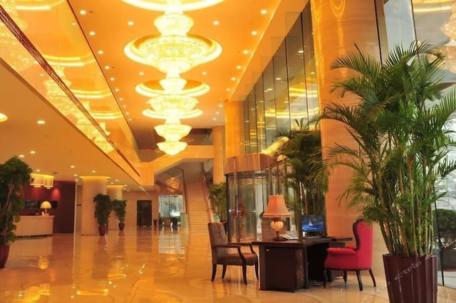 Luxurious Hua Du Hotel lobby with grand chandeliers, perfect for elegant events.