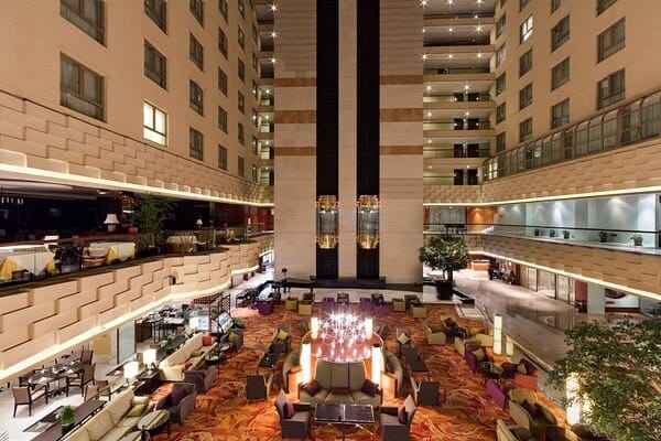 Spacious Shiji Huangshan Hotel lobby for casual meetings and networking events.