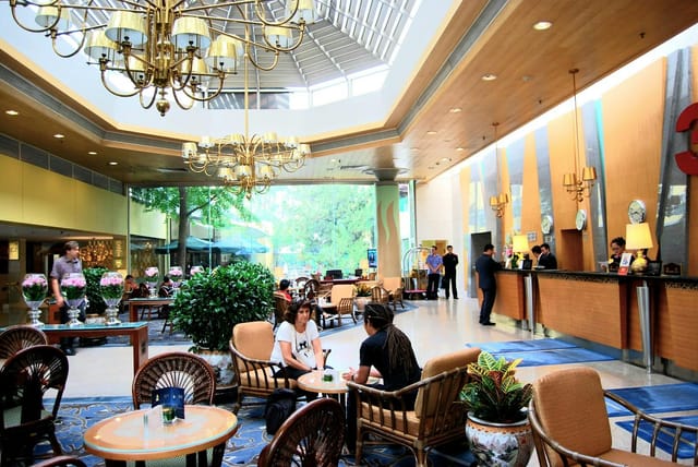 "Spacious Jianguo Hotel Beijing lobby ideal for networking events and meetings."