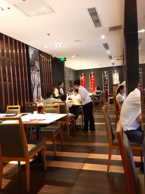 Modern dining space in Yuyang Hotel Beijing, perfect for intimate events and networking.