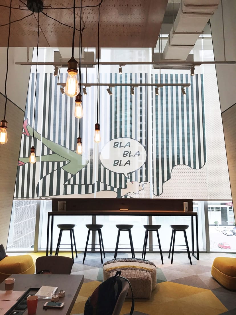 Modern meeting space in Hotel Jen Beijing, featuring a vibrant mural for creative events.
