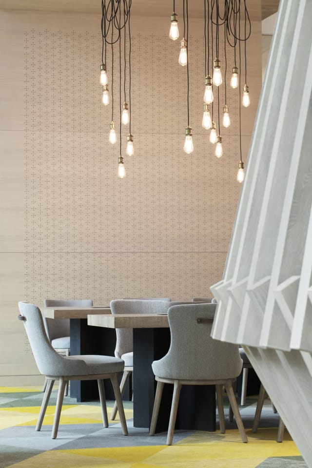Modern meeting space at Hotel Jen Beijing with minimalist design, ideal for collaborative events.