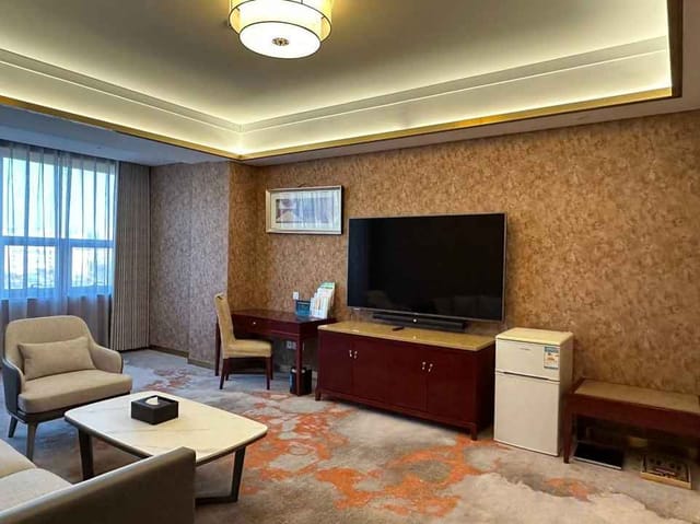 Beijing Jingyi Hotel meeting room with modern decor, ideal for executive briefings.