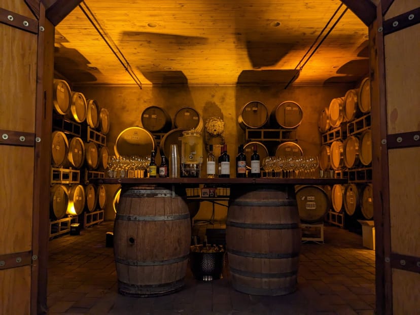 Charming La Honda Winery wine cellar with wood barrels, perfect for private events and tastings.