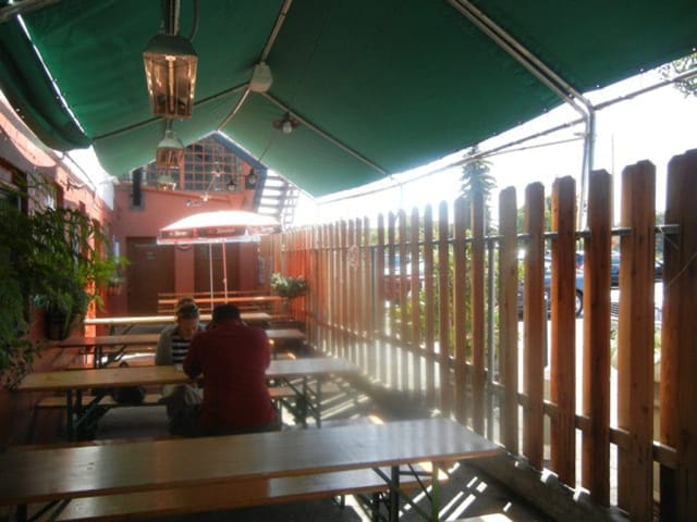 Beer hall outdoor venue with shaded seating, ideal for networking and team-building events.
