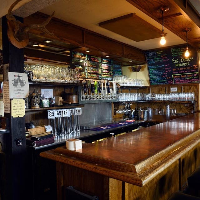 Beer hall bar at Gourmet Haus Staudt, polished wood counter, ideal for networking events.