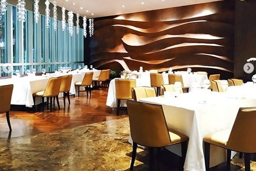 Elegant dining area at AMUZ Gourmet Restaurant, perfect for upscale events and meetings.