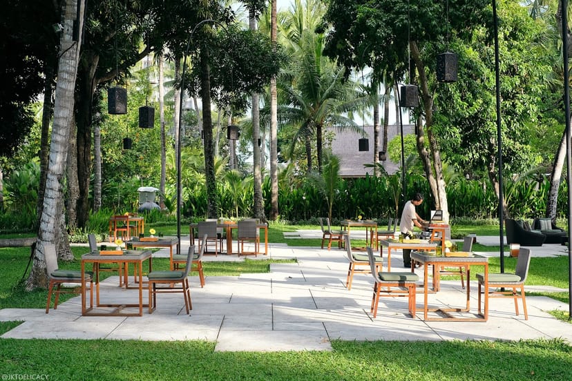 Elegant outdoor garden at Cuca Restaurant, perfect for events and gatherings.
