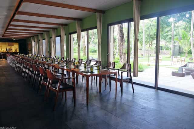 Private dining room at Cuca Restaurant with elegant wooden table for events and gatherings
