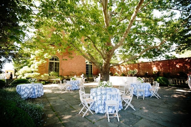 Elegant outdoor event space at Filoli with floral tablecloths, perfect for weddings and gatherings.