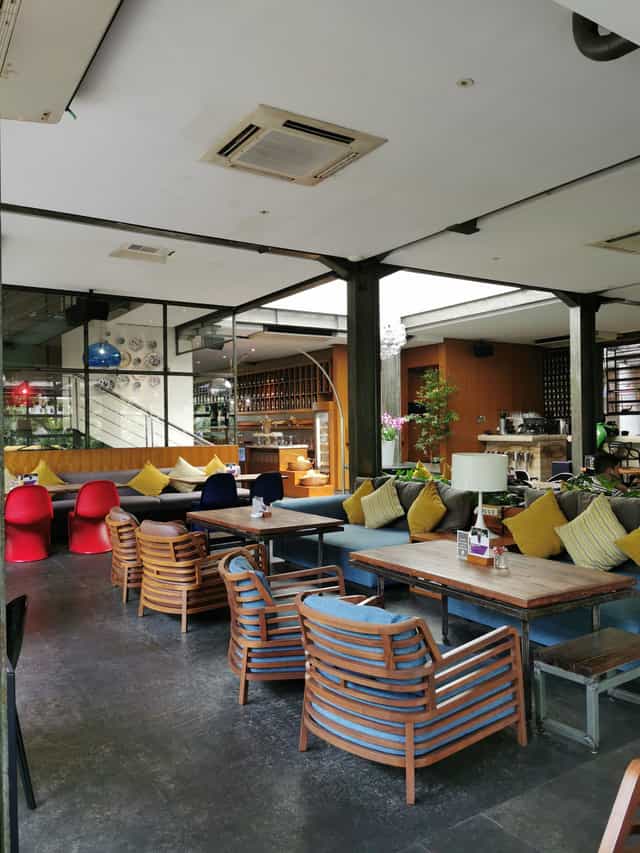 Outdoor event space at FJ Bistro & Deli with modern seating, ideal for networking and meetings.