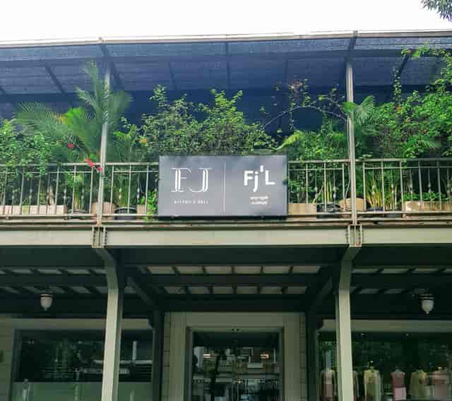 Outdoor venue at FJ Bistro & Deli with lush greenery for outdoor events.