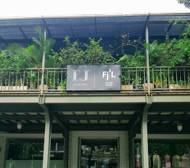 Outdoor venue at FJ Bistro & Deli with lush greenery for outdoor events.
