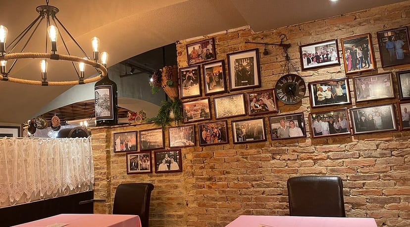 Cozy dining venue with exposed brick walls for intimate receptions and private dinners.