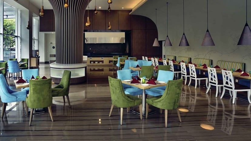 Modern conference room at Mercure Serpong with vibrant chairs for events and meetings.