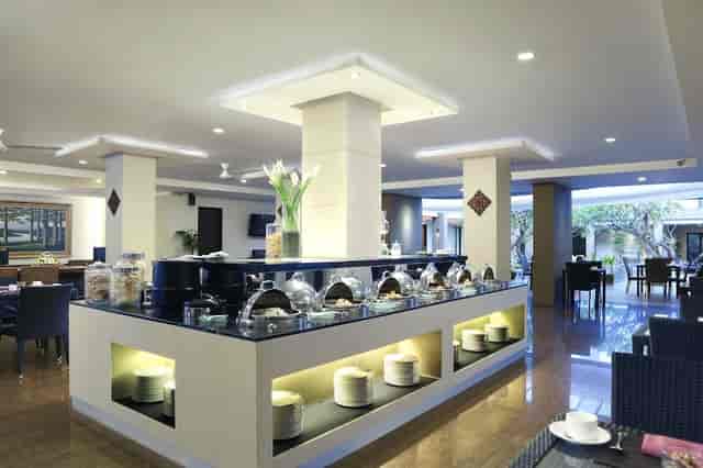Restaurant dining area at Hotel Santika Kuta Bali, ideal for networking events and receptions.