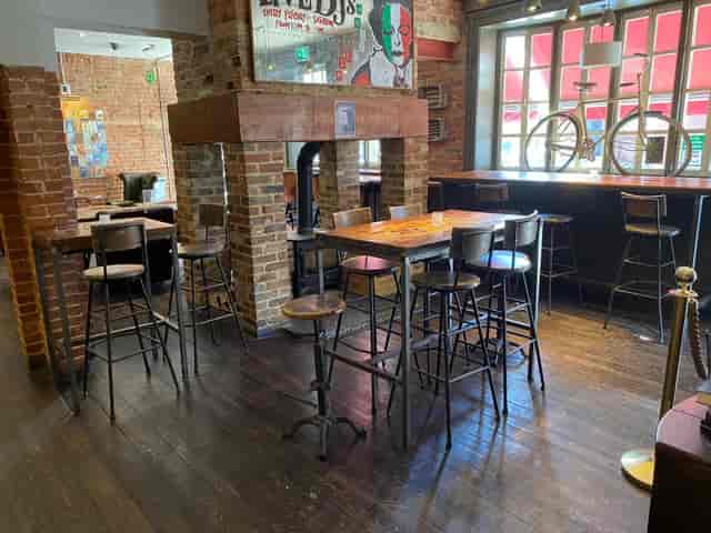 Rustic sports bar in Bar Italia Uxbridge, perfect for casual gatherings and networking events.