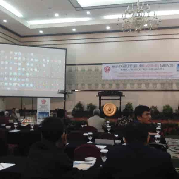 Ballroom at Hotel Grand Cempaka, tables set for a conference, professional networking event.