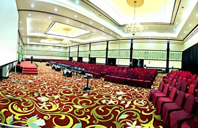 Ballroom at Hotel Grand Cempaka, elegant setup for conferences and seminars.
