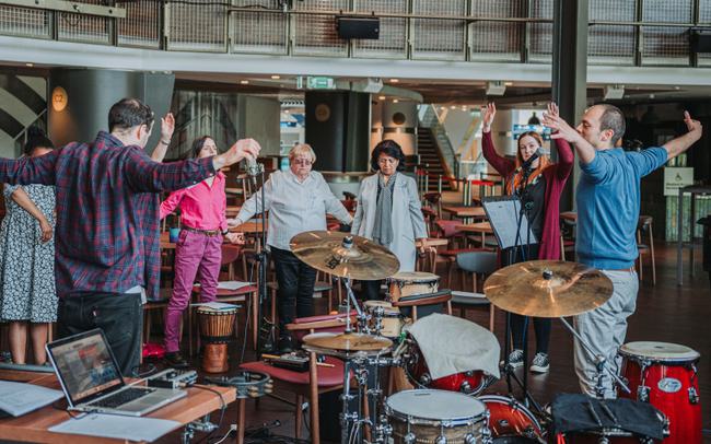 Dynamic team-building session in Justham Family Room with collaborative brainstorming. - Banner