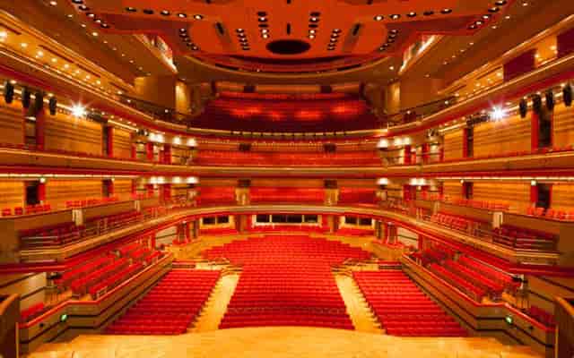 Symphony Hall auditorium with red seating, perfect for conferences and performances.