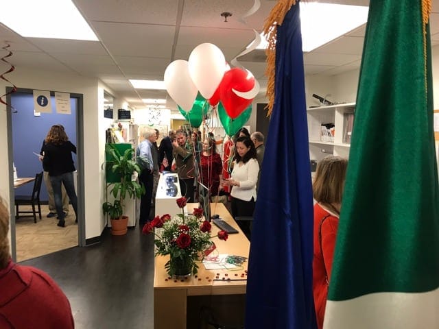 Vibrant reception at Italian Cultural Society with colorful balloons for cultural celebration.