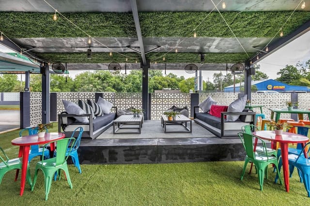 Vibrant outdoor lounge at Heights House Hotel, perfect for networking events and gatherings.