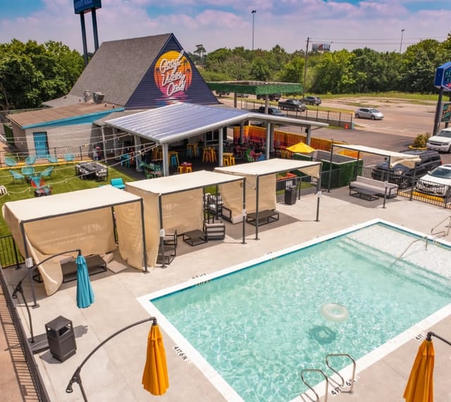 Vibrant outdoor event space at Heights House Hotel with pool and cabanas for summer gatherings.