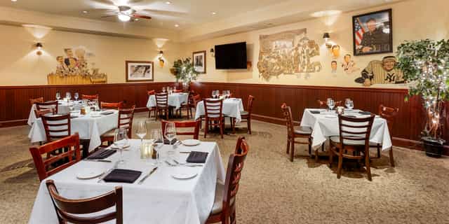 Elegant dining space in The Palm Restaurant for intimate meetings and private events.
