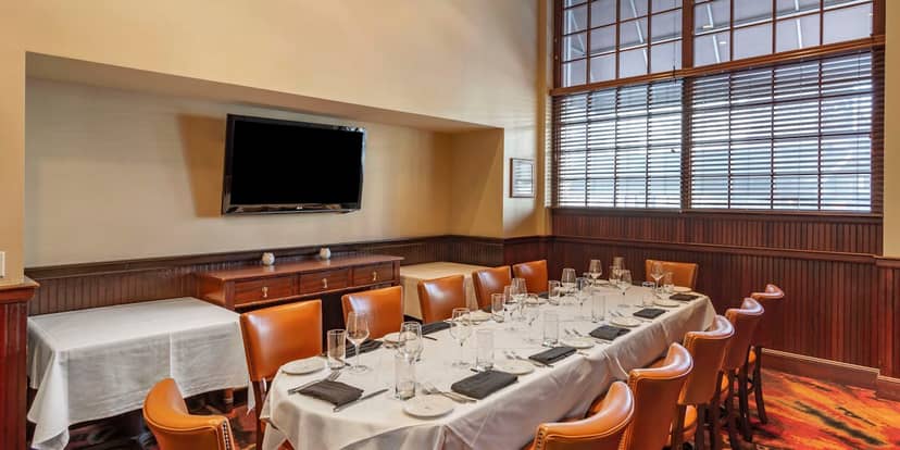 Intimate dining setup in Boardwalk Room at The Palm Restaurant for private events.