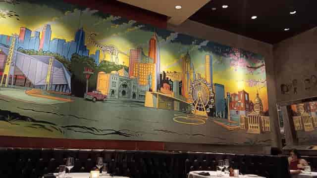 Chairman Room mural at The Palm Restaurant, vibrant backdrop for events and meetings.