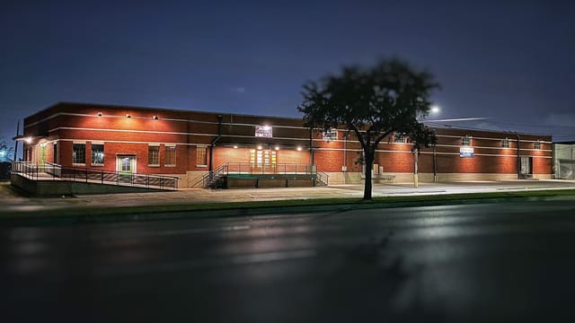 Warehouse Venue exterior, evening lighting, ideal for events and gatherings.