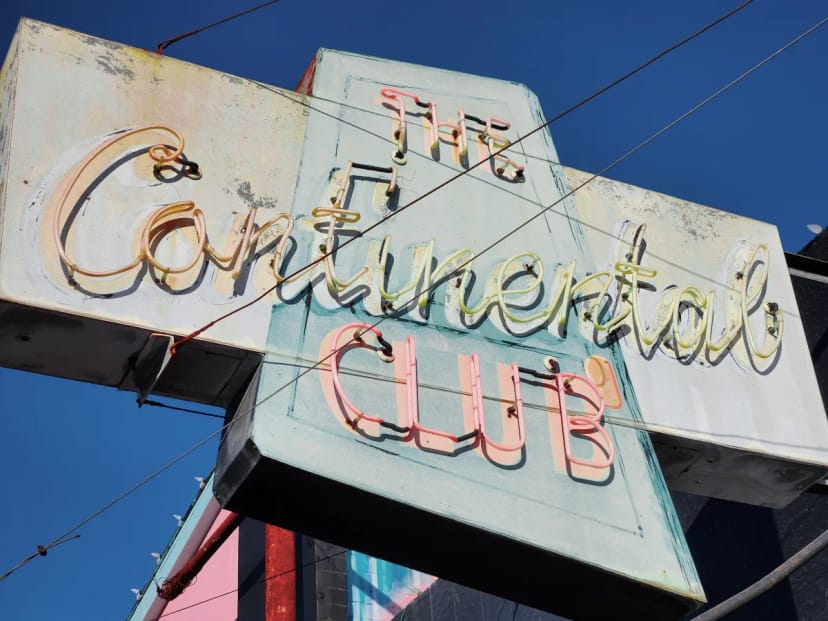 Vintage neon sign at The Continental Club, ideal for live music events and gatherings.